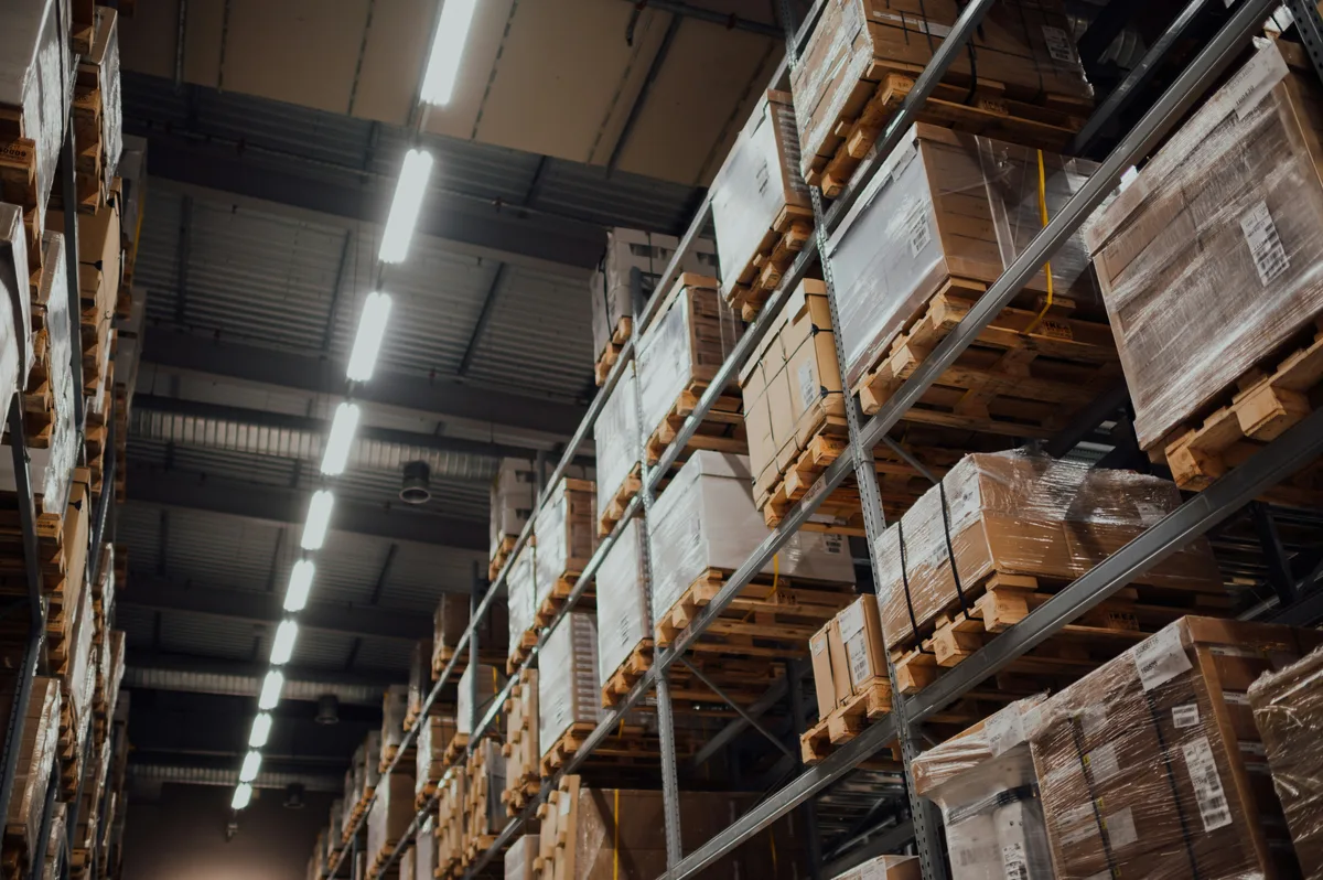 Cardboard shipping boxes on warehouse racks for dimensional weight calculation
